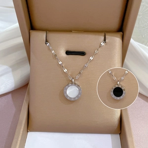 Detail view of silver titanium necklace with Roman numerals and white mother of pearl inlay