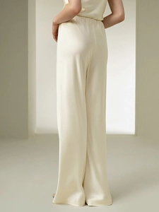 Elegant pearl white satin wide-leg trousers and sleeveless top set with a silky finish
