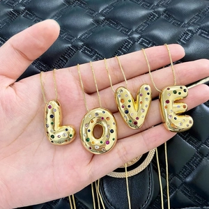 Gold plated LOVE letter necklaces with colorful cubic zirconia stones on gold cross chains