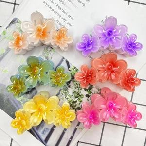 Elegant five-petal flower hair claws in multiple colors like orange and pink for women