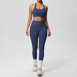 Detail of navy blue yoga set featuring a racerback bra and high-waist pocket leggings
