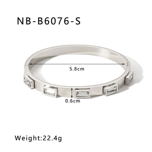 Detail view of 18k gold plated stainless steel bangle showing 5.8cm size and weight