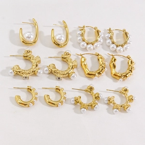 Detailed collection of six pairs of gold-plated earrings with pearls and crystals