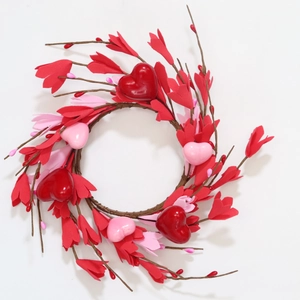 Couronne de Saint-Valentin avec cœurs brillants roses et rouges sur anneau de brindilles