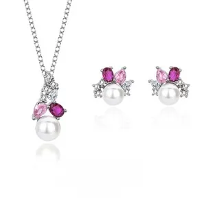 Macro detail of S925 silver jewelry set featuring white pearls and colorful gemstones