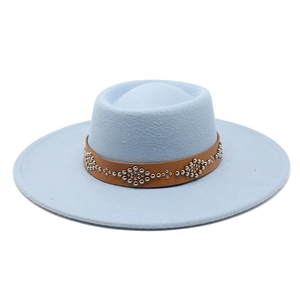 Close-up of light blue felt hat with brown leather band and silver rivet accents