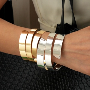 Minimalist geometric gold and silver wide spiral cuff bracelet for wrists and arms