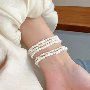 Elegant multi-layer round shell bead stretch bracelet with minimalist pearly white finish