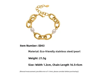 Close-up of golden chain bracelet with white shell pearls and lobster clasp detail