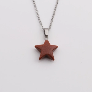 Minimalist star pendant necklace featuring a reddish-brown sparkling goldstone on silver chain