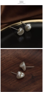 Macro detail of Baroque irregular freshwater pearl earrings with 925 silver studs