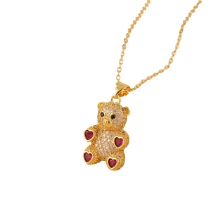 Golden teddy bear pendant necklace with pave diamonds and red heart gemstones