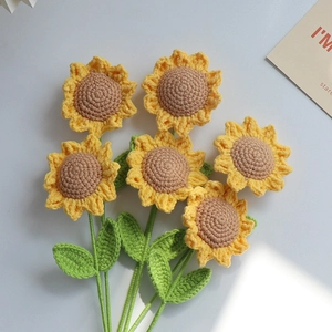 Handmade crochet sunflower bouquet with six vibrant knitted flowers on white background