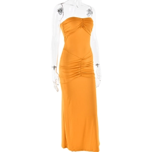 Detail of the elegant ruched fabric on a strapless orange bodycon evening gown