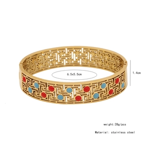 Detail view of vintage stainless steel bangle showing size measurements and colorful stones