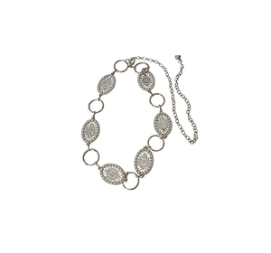 Detailed view of silver metal waist chain with circular rings and hollow flower pendants
