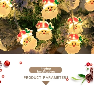 Macro detail of 3D Santa Claus LED string lights glowing on a snowy Christmas tree branch