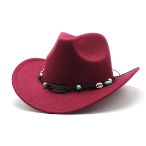 Detail of burgundy wool cowboy hat with bohemian bead and seashell decorative band