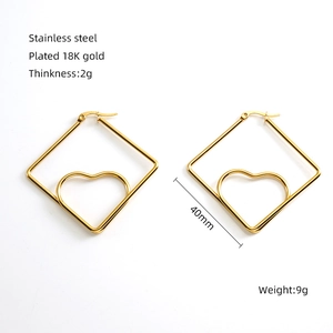 Detail view of 18K gold plated heart earrings in square hoops with 40mm dimension