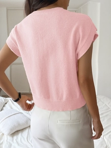 Rear view of a pink short-sleeved knitted sweater with ribbed hem and soft texture