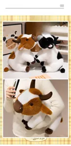 Close-up of soft plush brown and black spotted cow dolls in a cozy home setting