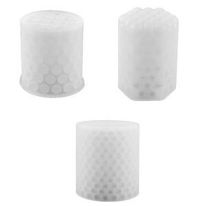 Set of three white silicone cylindrical candle molds with diverse dot and honeycomb textures