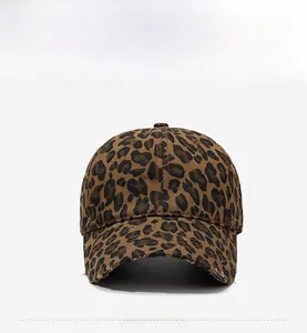 Detailed view of the distressed brim and vintage leopard print cotton canvas cap texture