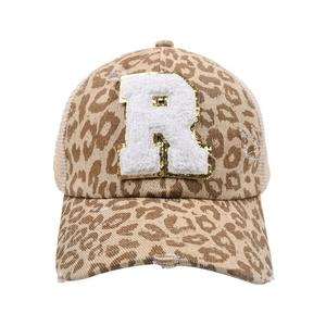 Distressed leopard print ponytail baseball cap with white chenille letter R patch