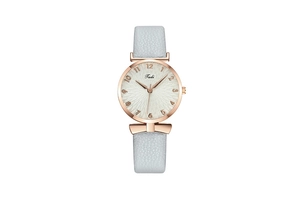 Detail of rose gold quartz watch featuring a white textured dial and light grey strap