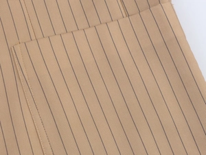 Detailed macro view of khaki striped linen blend fabric with precise twill texture