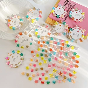 Close-up of assorted mini colorful resin hair clips in butterfly and star shapes