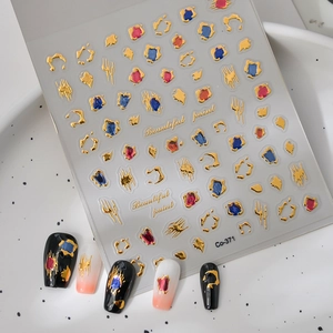 Macro view of 3D golden embossed nail stickers with liquid paint design, model Co-371