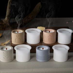 Minimalist geometric pillar candle silicone molds with finished candles and wood wicks