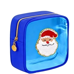 Detail of blue cosmetic bag with Santa Claus patch and gold zipper closure