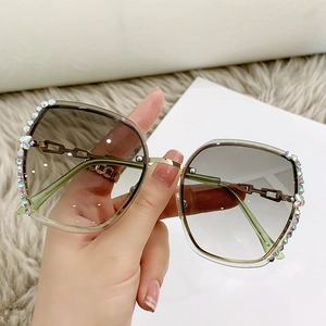 Frameless butterfly sunglasses with gradient brown lenses and rhinestone-encrusted edges