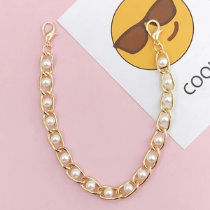 DIY phone case gold metal chain with faux pearls and lobster clasps on pink background