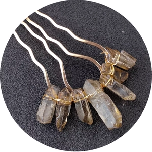 Handmade gold metal hair comb featuring natural clear crystal stones with wire wrap
