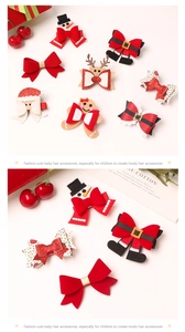 Detail of Christmas hair clips featuring sequin bows and reindeer motifs for kids