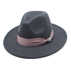 Detail of dark gray fedora with pink satin band and silver rhinestone buckle decoration