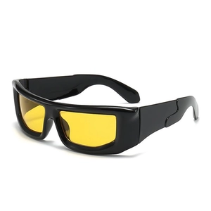 Futuristic Y2K punk sports sunglasses with black thick frames and yellow tinted lenses