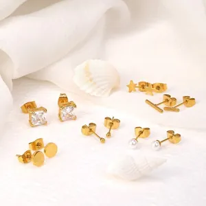 6-pair 18K gold plated earring set with pearls and star designs on white silk