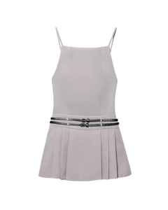 Detail of grey pleated camisole dress featuring thin black buckled waist belts