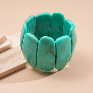 Close-up of mint green marble pattern acrylic resin bracelet with elastic rectangular links