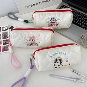 Detail view of quilted heart pattern and cute puppy embroidery on stationery bags.