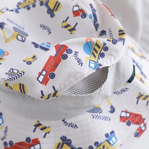 Detail of grey sun hat showing breathable white mesh and colorful truck prints