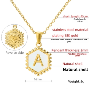 Detail of 18K gold hexagon letter A pendant with shell inlay and sunflower back texture