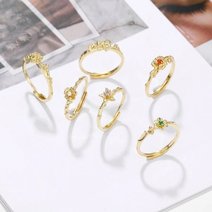 6-piece gold flower ring set with colorful birthstone gems and adjustable bands