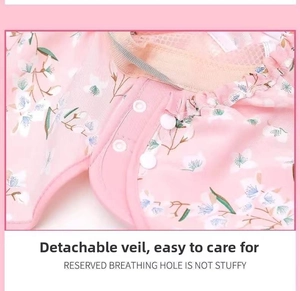 Detail of pink floral sun hat featuring a detachable mesh veil and breathable fabric
