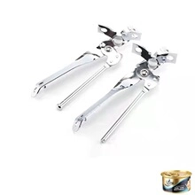 Detail of two mini stainless steel spring whisks with butterfly-style handles on white