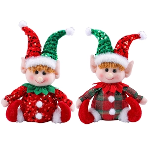 Cute Christmas elf dolls with sequined hats and plaid outfits for holiday window decor